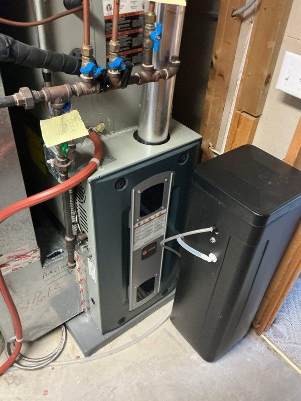 Performed diagnostic inspection on water softener system after customer reported concerns about functionality following inadvertent button pressing. Visual inspection of water softener, hot water heater, and triple-filter water treatment system revealed no operational issues or malfunctions. Reset controls to proper settings and verified system is functioning according to specifications.