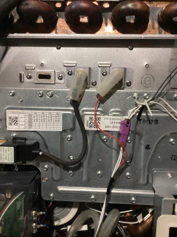 Diagnosed tankless water heater with no hot water issue. Performed maintenance including clearing condensate line, cleaning exhaust/intake, and cleaning igniters. System continued to display Error 11 (no ignition); recommended replacement of igniter assembly.