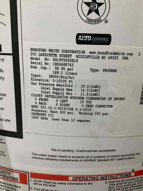 Removed existing Richmond tankless water heater and installed a Bradford White 50-gallon LP power vent water heater (Model: RG1PV5086X19, Serial: CB56668743) with 38,000 BTU/hr input rating. Unit installed in compliance with manufacturer specifications, ANSI Z21.10.1-2019/CSA 4.1-2019 standards, and ASHRAE Standard 90.1 energy efficiency requirements, with permit obtained as applicable.