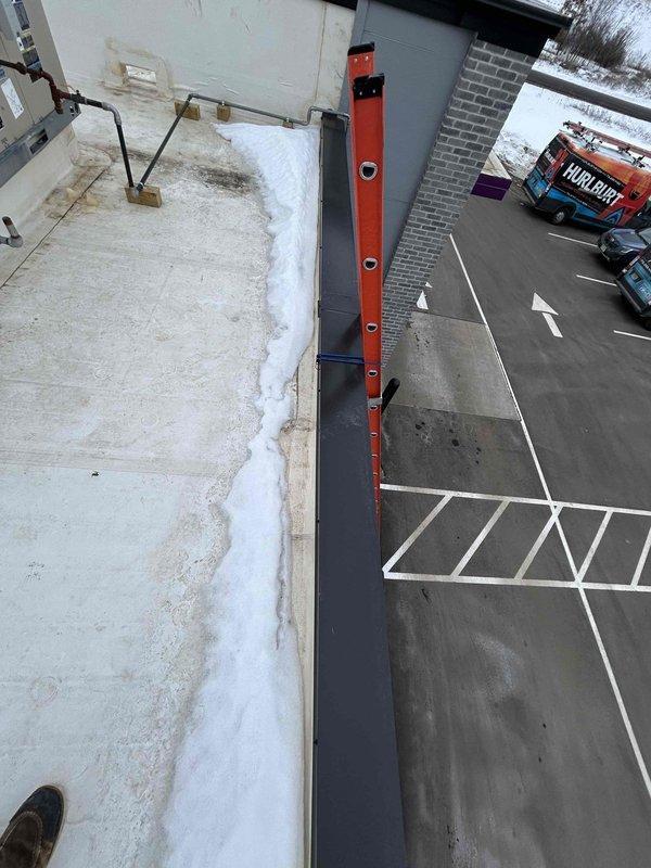 Diagnosed heating issue on commercial 8-12 RTU installed in November by Hovland's. Discovered bath fans/occupancy sensors were improperly wired to economizer through thermostat, causing economizer to open fully during daytime operation and preventing proper heating. Disconnected occupancy wire from RTU control board, allowing economizer to maintain 10% fresh air intake without fully opening. This modification should resolve the continuous heating operation and inability to maintain temperature above 60-65°F.
