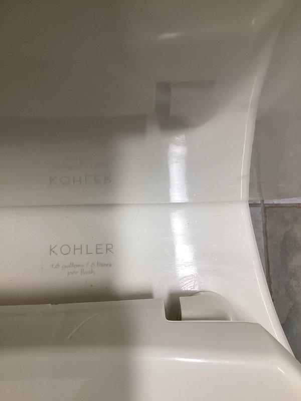 Responded to a backflow inspection follow-up at commercial property where previous inspection identified compliance issues with upstairs toilets. Adjusted fill valve height on Kohler 1.6 gpf toilet fixtures to maintain required 1-inch clearance above overflow tube as mandated by code. Documented completed adjustments with photographic evidence of the modified installation.