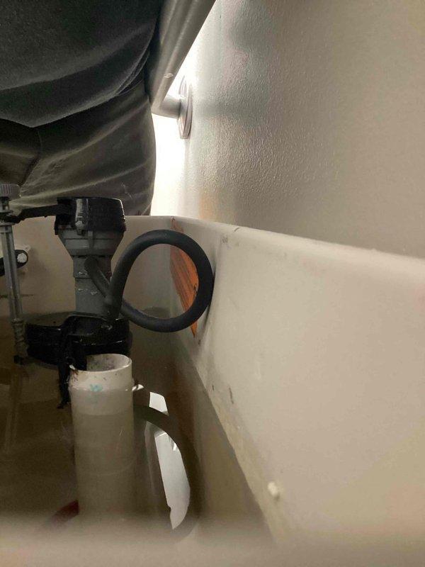 Responded to a backflow inspection follow-up at commercial property where previous inspection identified compliance issues with upstairs toilets. Adjusted fill valve height on Kohler 1.6 gpf toilet fixtures to maintain required 1-inch clearance above overflow tube as mandated by code. Documented completed adjustments with photographic evidence of the modified installation.