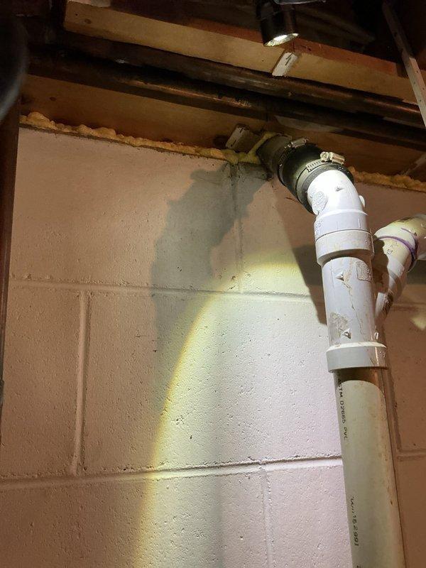 Successfully cleared a severe kitchen sink clog that was causing slow drainage and backup beyond the P-trap. Performed mechanical snaking of the drain line to remove accumulated black sludge that had been backing up through the dishwasher drain pipe. Inspected basement plumbing connections to ensure proper drainage flow was restored throughout the system.