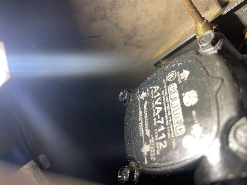 Inspected oil furnace due to reported noise and strong oil smell. Diagnosed incompatible components: 3450 RPM burner motor paired with 1725 RPM oil pump (Suntec AIVA-7112), causing dirty burn and oil odor. Submitted estimate for replacement pump with correct 3450 RPM specification to restore proper operation.