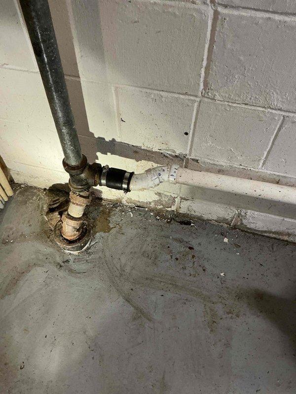 Responded to service call for clogged laundry drain. Diagnosed complete blockage in drainage line causing standing water. Successfully cleared obstruction using mechanical drain machine, restoring proper flow through the aging pipe system which showed signs of mineral buildup and corrosion at connection points.