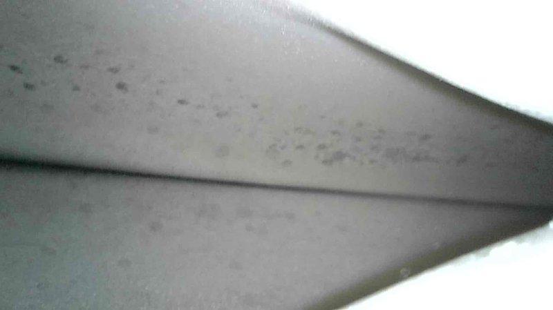 Responded to no heat call for 1-year-old natural gas furnace. Diagnosed limit switch fault code; found limit switch stuck open despite cool system. Observed heat exchanger was in good condition, but discovered Merv 13 filter clogged with white residue from ultrasonic humidifier. Replaced faulty limit sensor and air filter, restoring normal operation. Advised customer about humidifier options and recommended using distilled water if continuing ultrasonic humidifier use.